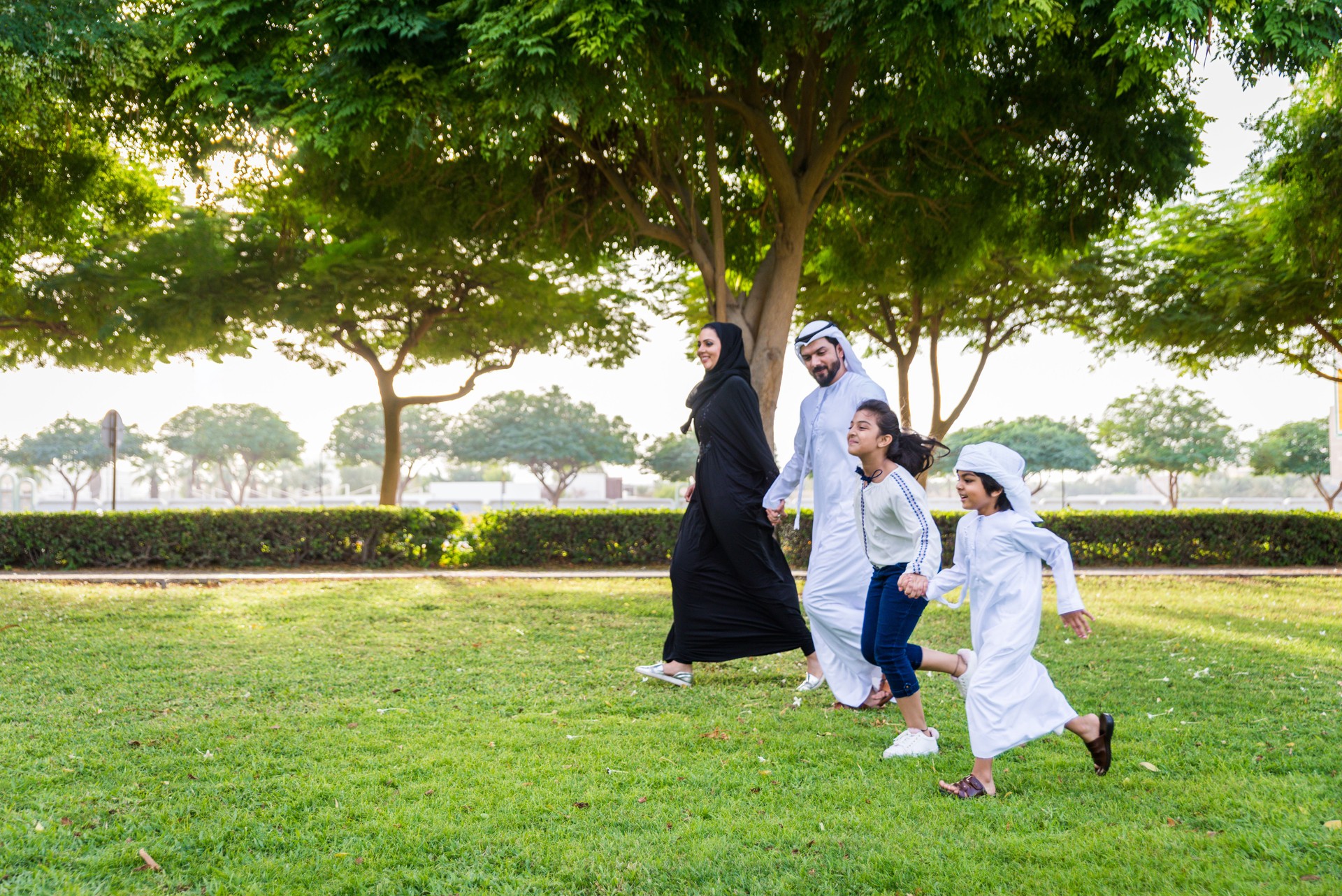 Happy arabian family in a park